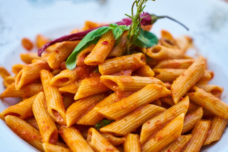 Penne Arrabbiata with spicy tomato sauce and fresh herbs